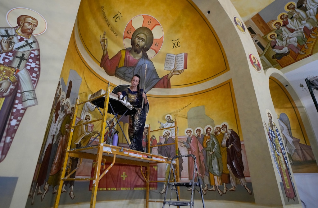 (Francisco Kjolseth | The Salt Lake Tribune) Maria Panou works on the altar space at St. Anna Greek Orthodox Church in Sandy on Wednesday, Sept. 27, 2023. Panou has joined a small team of iconographers from Athens to help transform the worship space.