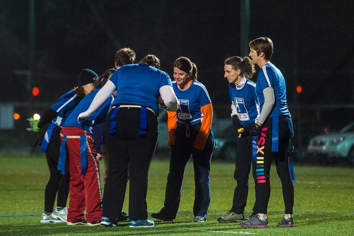(Chris Detrick | The Salt Lake Tribune) Team A Lot huddles during the flag football team game against Sim Team at North University Fields in Provo Thursday, November 30, 2017.