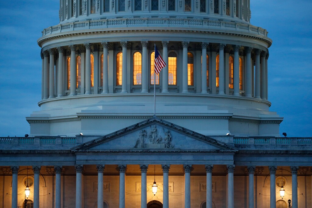 (Patrick Semansky | AP file photo)  Light shines from inside the U.S. Capitol dome at dusk on Capitol Hill in Washington on May 3, 2020.