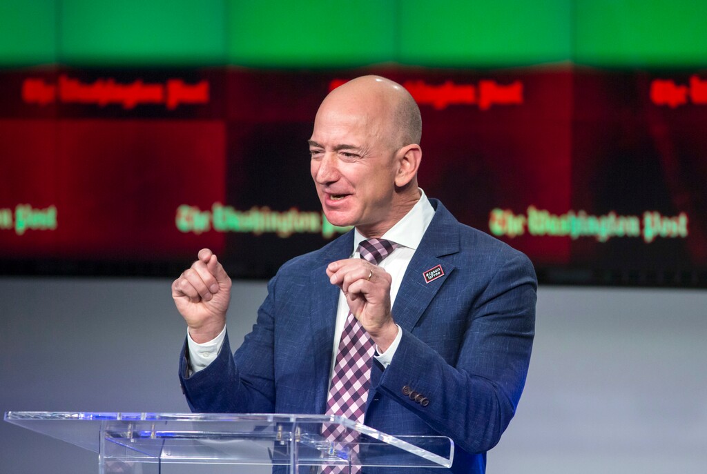 FILE - In this Jan. 28, 2016, file photo, billionaire Amazon founder and Washington Post owner Jeff Bezos talks about the history and character of the Post during a dedication ceremony for its new headquarters in Washington.   Bezos briefly became the world’s richest man Thursday, July 27, 2017 in Forbes magazine’s tracking of wealth, as stock in his e-commerce company hit an all-time high.  Microsoft founder Bill Gates reclaimed the lead by afternoon, as Amazon’s stock fell nearly 1 percent for the day to $1,046.   (AP Photo/J. Scott Applewhite, File)