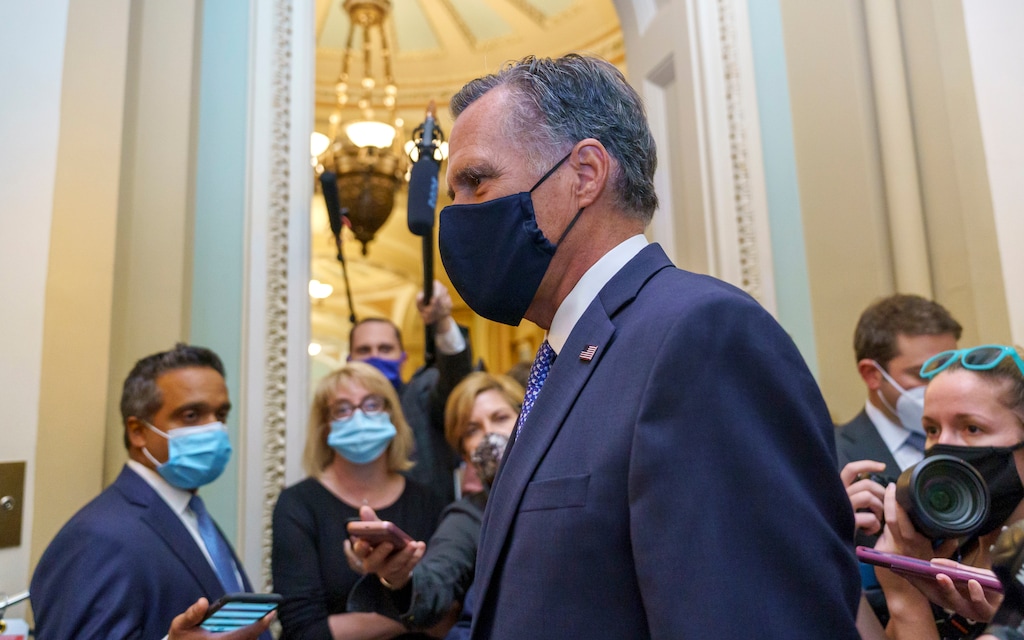 (AP Photo/J. Scott Applewhite) Sen. Mitt Romney, R-Utah, leaves the Senate Chamber following a vote, at the Capitol in Washington, Monday, Sept. 21, 2020.