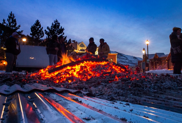 (Rick Egan  |  The Salt Lake Tribune)     People gather around the first-ever Sundance bonfire, a community gathering on Swede Alley, in Park City, Thursday, Jan. 30, 2020.