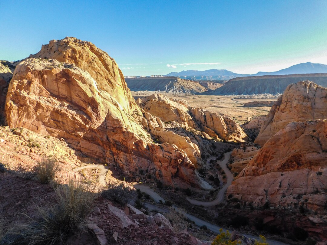 (Erin Alberty  |  Tribune File Photo)  The Burr Trail winds up the Waterpocket Fold and into the morning sun Oct. 5, 2015 in Capitol Reef National Park.