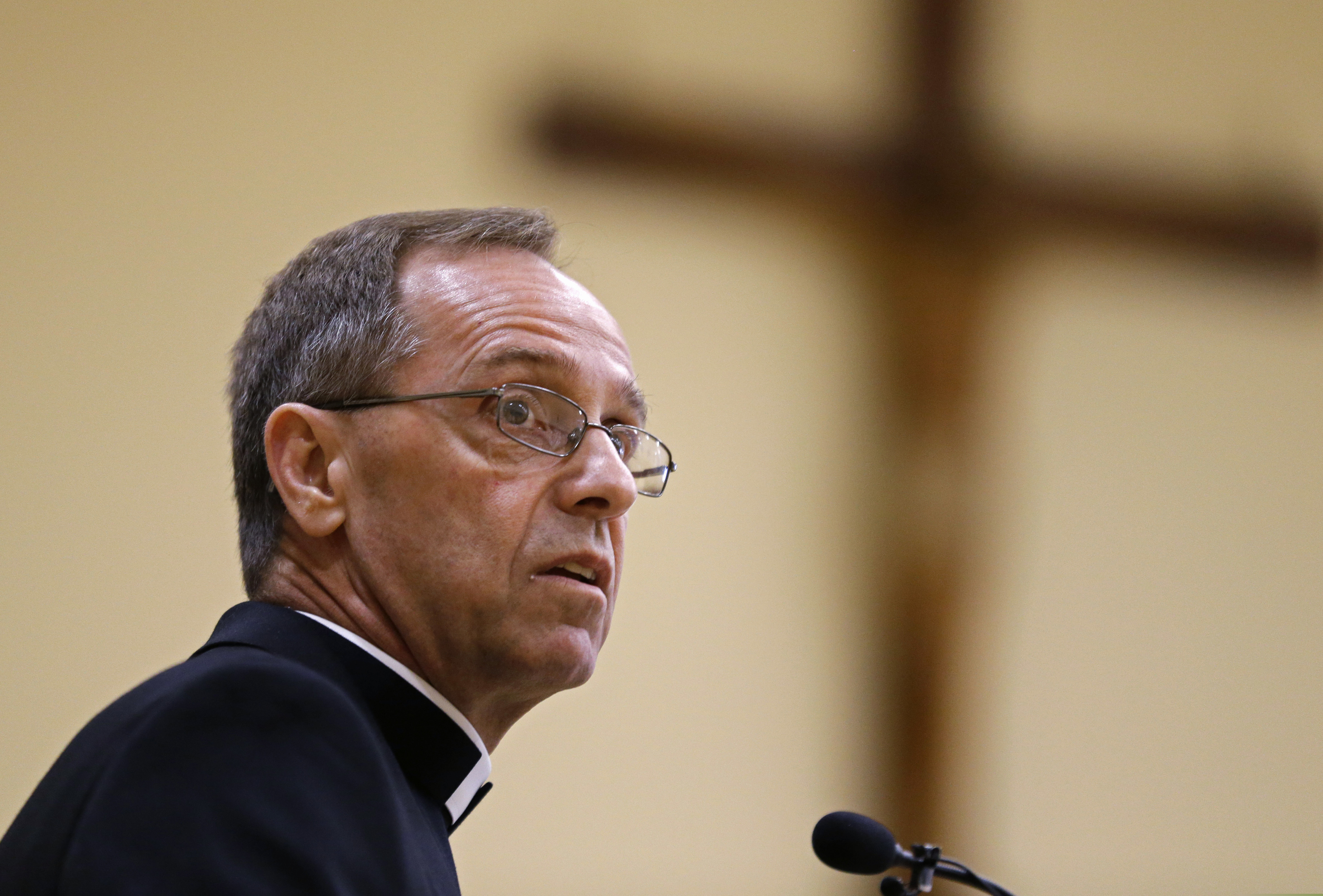 (AP Photo/Michael Conroy, File) In this June 13, 2017, file photo, Bishop Charles Thompson speaks after he is introduced as the new archbishop of Indianapolis in Indianapolis. The Archdiocese of Indianapolis says it no longer will recognize a Jesuit high school as Catholic because it refuses to fire a teacher who's in a same-sex marriage. It says a decree to be issued by Archbishop Thompson states Brebeuf Jesuit Preparatory School "can no longer use the name Catholic and will no longer be identified or recognized as a Catholic institution."