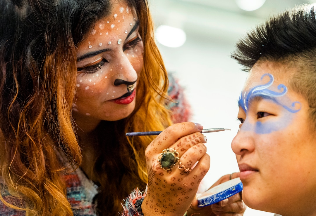 (Rick Egan  |  The Salt Lake Tribune)       Artist, Consu Nikolazza paints a festivalgoer’s face during the second annual Made in Utah Winter Fest at The Gateway.  The free festival includes local artists, musicians, artisans, breweries, distilleries, food trucks, and other local businesses, to help promote shopping locally for holidays. The Utah Winter Fest continues December 21 & 22. Sunday, Dec. 15, 2019.