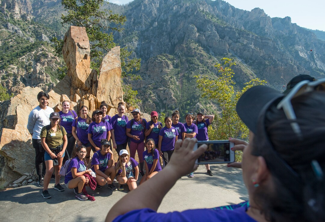 (Rick Egan  |  The Salt Lake Tribune)  Jen Sanchez takes a photo of the group of teens from the YouthWorks program by the Kodachrome Rock, as they take a break from their hike, on their way to Timpanogos Cave, Thursday, Aug. 3, 2017.