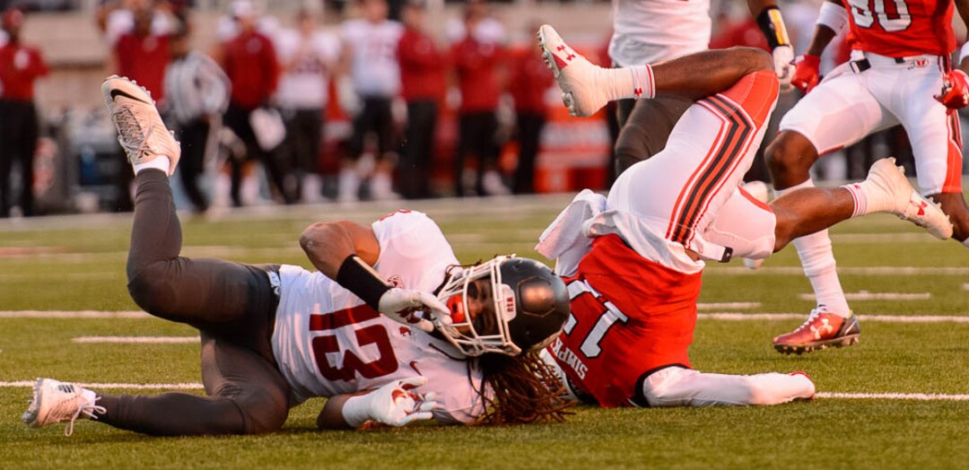 (Trent Nelson | The Salt Lake Tribune)  Utah Utes wide receiver Demari Simpkins (17) is brought down by Washington State Cougars linebacker Jahad Woods (13) as the University of Utah hosts Washington State, NCAA football in Salt Lake City, Saturday November 11, 2017.