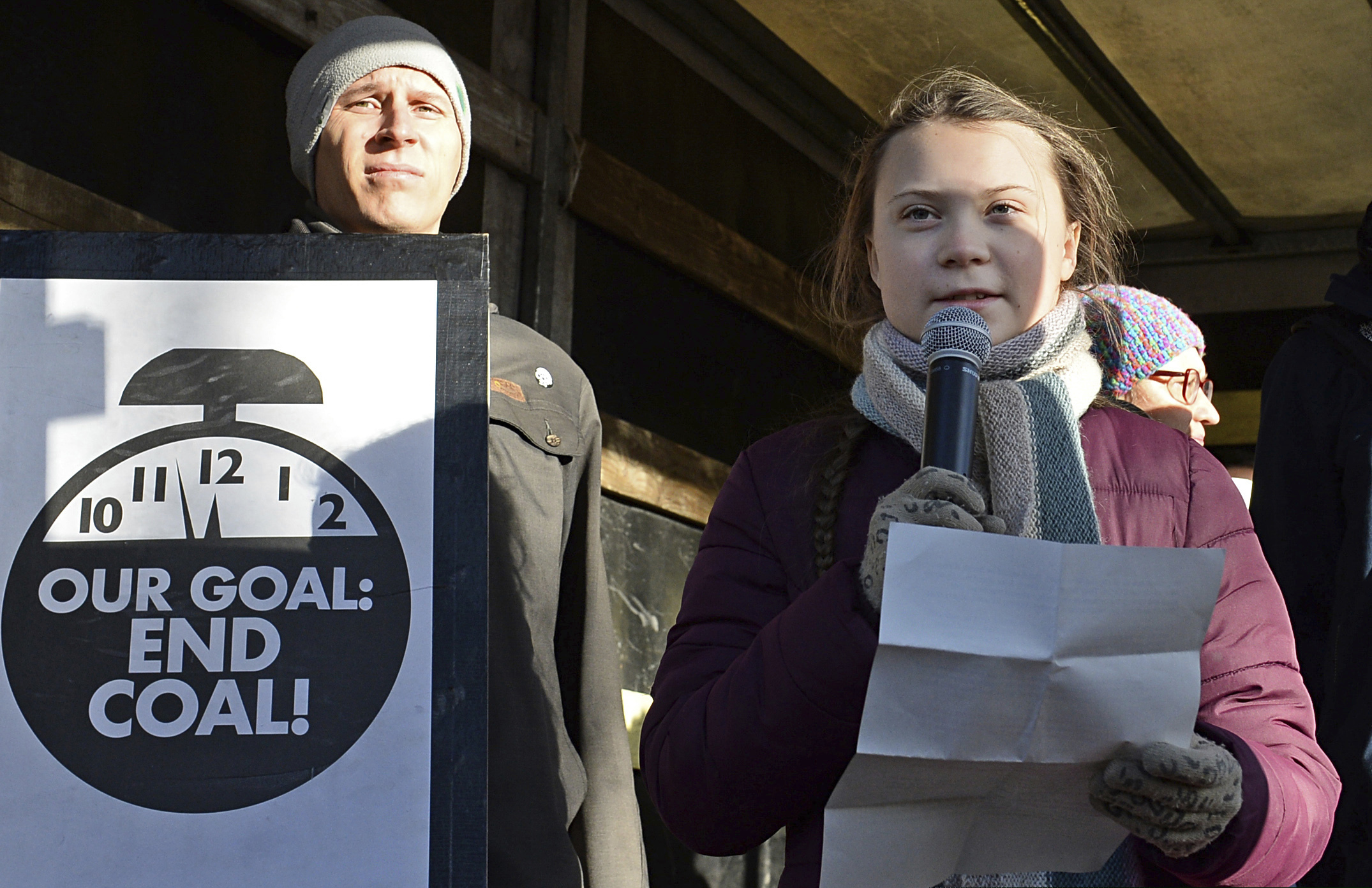 (Alik Keplicz | The Associated Press) Swedish young activist, 15-year-old Greta Thunberg, right, speaks to climate activists during the March for Climate in a protest against global warming in Katowice, Poland, Saturday, Dec. 8, 2018, as the COP24 UN Climate Change Conference takes place in the city.