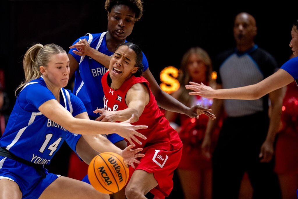 (Trent Nelson  |  The Salt Lake Tribune) BYU Cougars guard Kambree Barber (14) steals the ball from Utah Utes guard Lani White (0) as Utah hosts BYU, NCAA basketball in Salt Lake City on Saturday, Feb. 21, 2026.