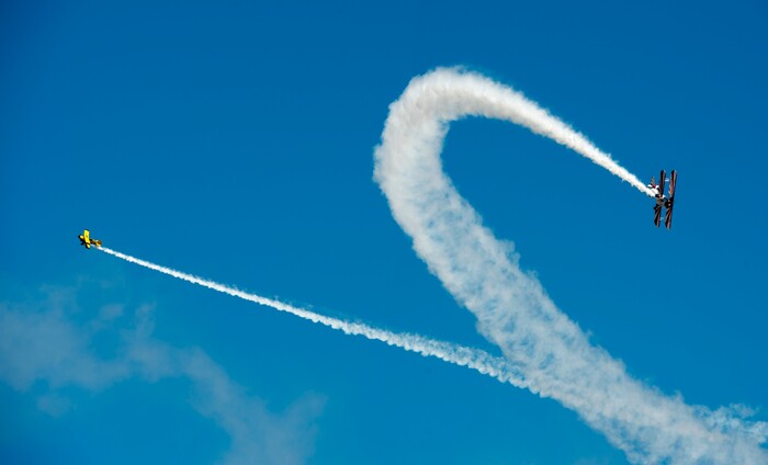 (Rick Egan  |  The Salt Lake Tribune)   Buck Roetman flies in his Pitts S-2S, along with Gary Rower in his 1941 Stearman, at the Warriors Over the Wasatch airshow at Hill Airforce Base, Sunday, June 24, 2018.