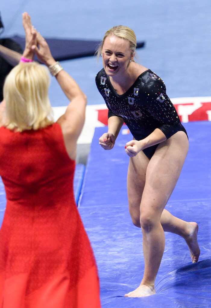 (Leah Hogsten  |  The Salt Lake Tribune)  Maddy Stover celebrate her beam routine with head coach Megan Marsden. The fourth-ranked Utes compete against No. 9 California, No. 16 Auburn, No. 21 Brigham Young, Stanford and Southern Utah, during the the NCAA Regional Championships, Saturday, April 7, 2018 at the Huntsman Center. The top two teams advance to the NCAA Championships April 20-21 in St. Louis.
