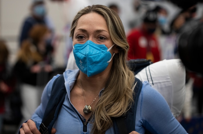 (Rick Egan | The Salt Lake Tribune) USA skeleton racer Katie Uhlaender talks to reporters as she and other Team USA Olympians arrive at the Salt Lake City International Airport on Monday, Feb. 21, 2022.