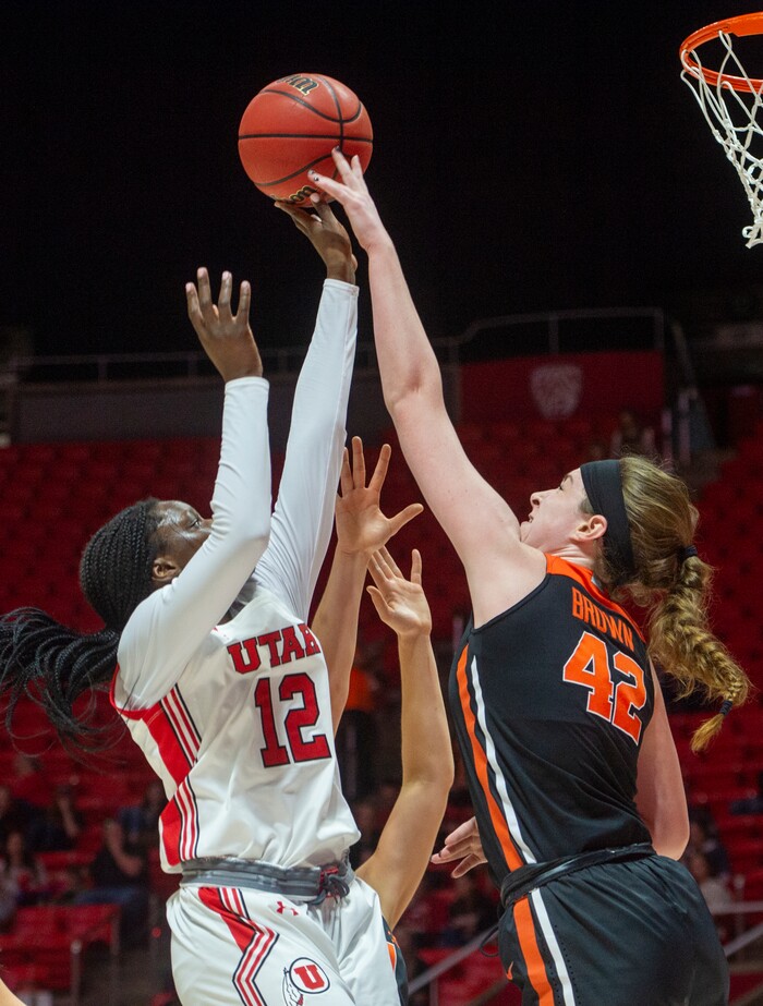 (Rick Egan  |  The Salt Lake Tribune)     Utah Utes forward Lola Pendande (12) shoots,  as Oregon State Beavers forward Kennedy Brown (42) gets a hand on the ball, in PAC-12 basketball action between the Utah Utes and the Oregon State Beavers at the Jon M. Huntsman Center, Saturday, Feb. 1, 2020.