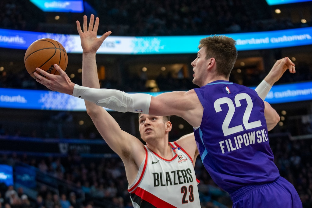 (Rick Egan | AP) Utah Jazz forward Kyle Filipowski (22) goes for an underhand shot as Portland Trail Blazers center Donovan Clingan (23) defends during the first half of an NBA basketball game Monday, Feb. 24, 2025, in Salt Lake City.