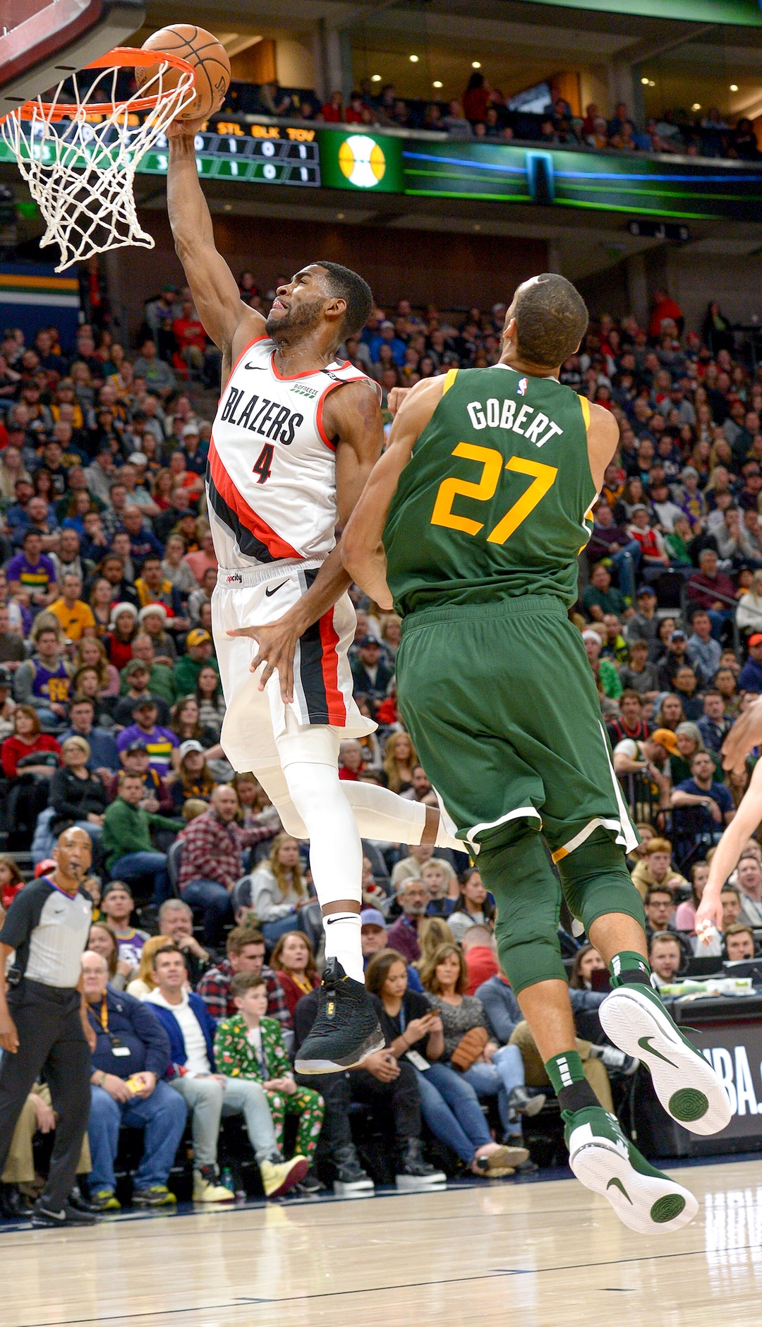 Leah Hogsten  |  The Salt Lake Tribune  Portland Trail Blazers forward Maurice Harkless (4) scores on Utah Jazz center Rudy Gobert (27)as the Utah Jazz host the Portland Trail Blazers Christmas night at Vivint Smart Home Arena.