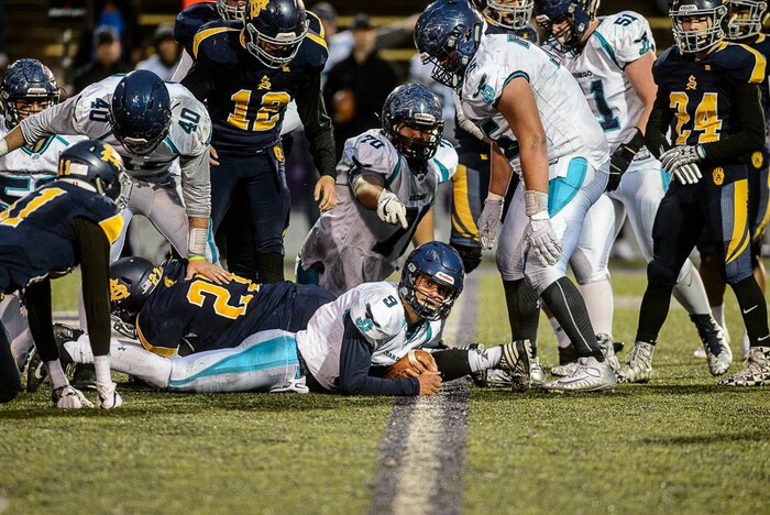 (Trent Nelson | The Salt Lake Tribune)  Juan Diego quarterback Zachary Hoffman makes sure his dive was far enough for a first down (it was). Summit Academy faces Juan Diego High School in a class 3A state semifinal football game at Weber State University's Stewart Stadium, Saturday November 4, 2017.