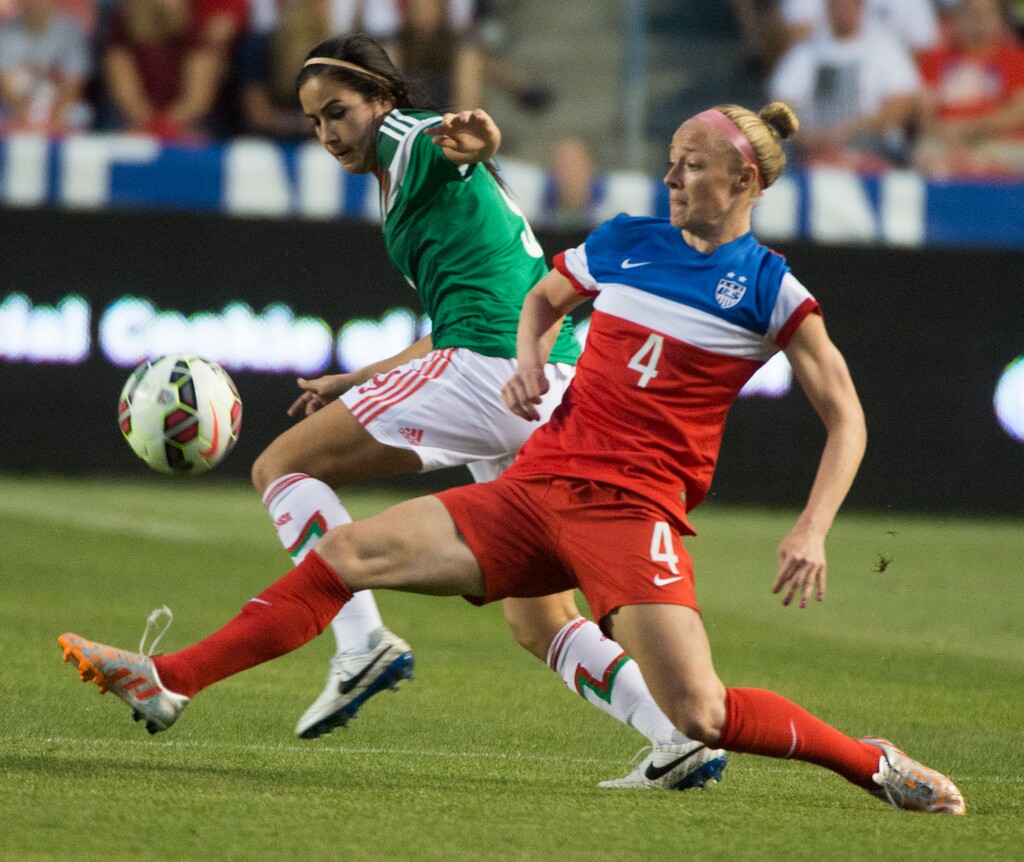 Rick Egan | The Salt Lake Tribune
Becky Sauerbrunn (4)USA, gets her foot on the ball, as Tanya Samarzich (9), Mexico, defends, in Soccer action, U.S. Women's National Team, vs. Mexico, Saturday, September 13, 2014