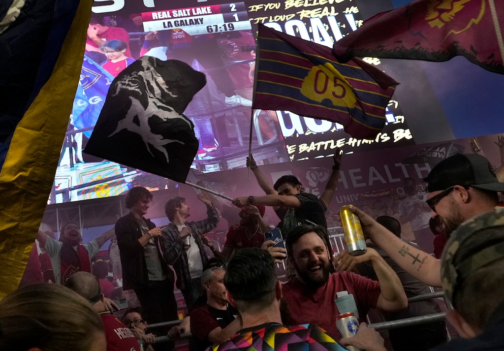 (Leah Hogsten | The Salt Lake Tribune) Members of La Barra Real cheer on Real Salt Lake during their game against the LA Galaxy, May 31, 2023. America First Field installed metal bars in part of the south goal section of the stadium and took out the seats to make it so the fans in that section can stand the entire game.
