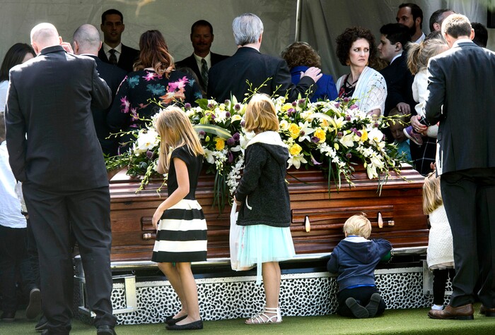 (Steve Griffin  |  The Salt Lake Tribune)  People gather around the casket following graveside services for Elder Robert D Hales at the Bountiful City Cemetery in Bountiful Friday October 6, 2017.
