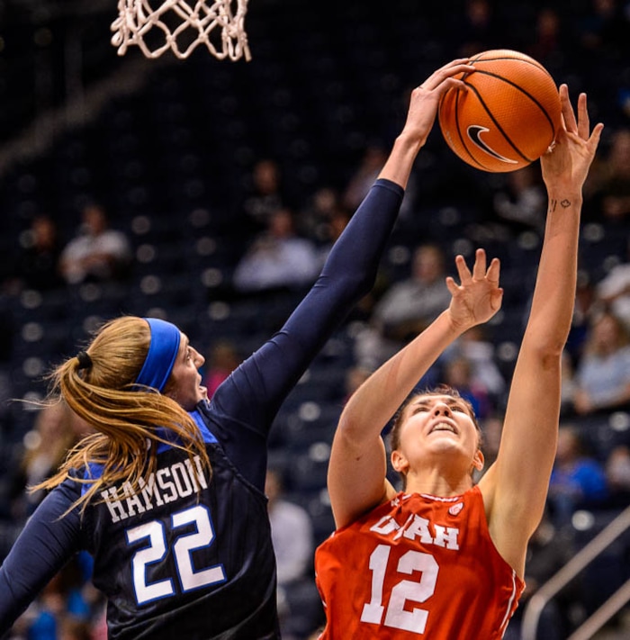 (Trent Nelson | The Salt Lake Tribune)  Brigham Young Cougars center Sara Hamson (22) blocks a shots by Utah Utes forward Emily Potter (12) as BYU hosts Utah, NCAA women's basketball in Provo, Saturday December 9, 2017.