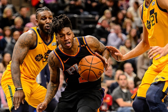 (Trent Nelson | The Salt Lake Tribune)  Phoenix Suns guard Elfrid Payton (2) drives between Utah Jazz forward Jae Crowder (99) and Utah Jazz center Rudy Gobert (27) as the Utah Jazz host the Phoenix Suns, NBA basketball in Salt Lake City, Wednesday Feb. 14, 2018.