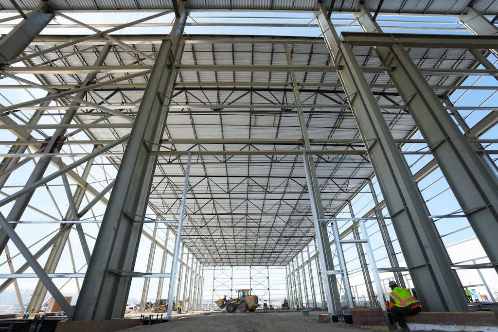 (Bethany Baker | The Salt Lake Tribune) Construction workers prepare the ground for pouring concrete in the new welding hall at the Stadler manufacturing facility in Salt Lake City on Wednesday, April 9, 2025.