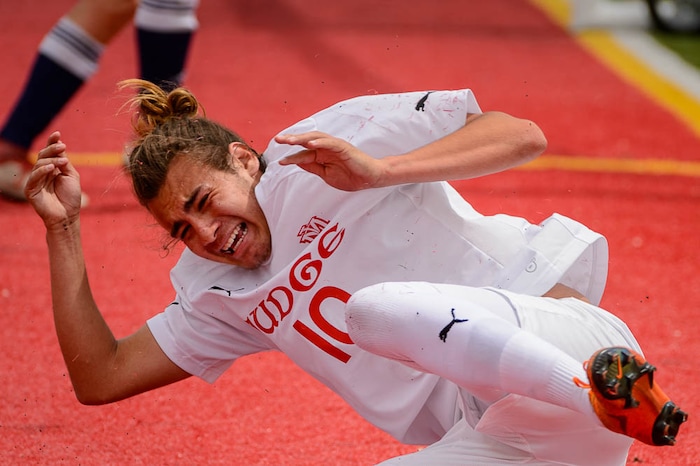 (Trent Nelson | The Salt Lake Tribune)  Judge Memorial's Cameron Lundy (10) falls after being fouled in the Class 3A boys' soccer state quarterfinal between Judge Memorial and Maeser Prep in Salt Lake City, Saturday May 5, 2018.