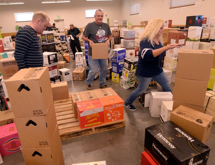 (Al Hartmann  |  The Salt Lake Tribune) 	Employees at the Cottonwood Heights state liquor store sort through a big shipment of spirits Wednesday Nov. 22.  The Wednesday before Thanksgiving is typically one of the busiest days for liquor sales in Utah. Customers typically line up outside before the 11 a.m. opening.   Extra employees work to handle the holiday rush. 