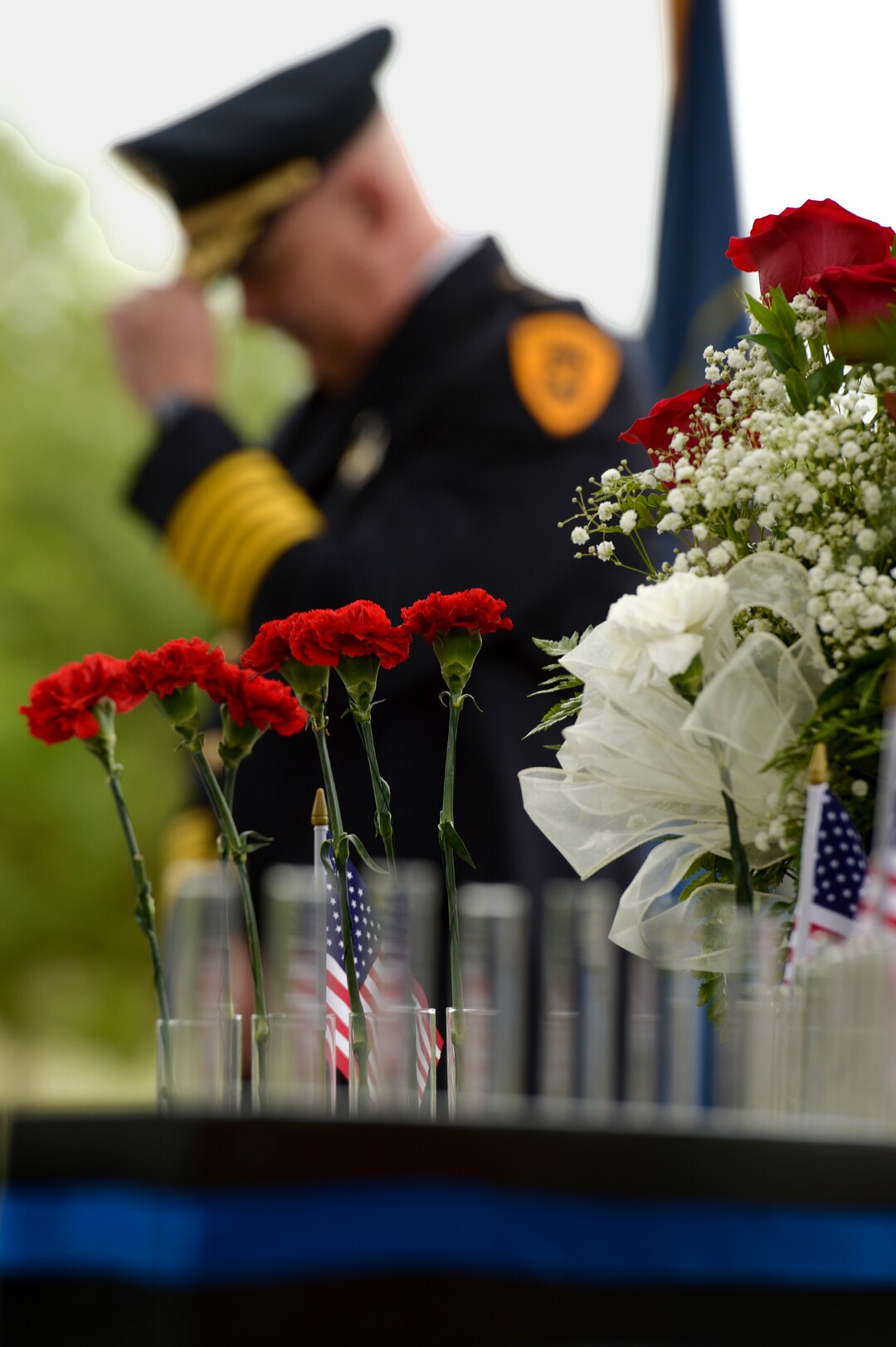 (Leah Hogsten  |  The Salt Lake Tribune)  Salt Lake City Police Chief Mike Brown adjusts his hat during the ceremony. In honor of Police Week, the Salt Lake City Police Department honored its fallen officers with a memorial service and a 21-gun salute at the Public Safety Building, Thursday, May16, 2019.