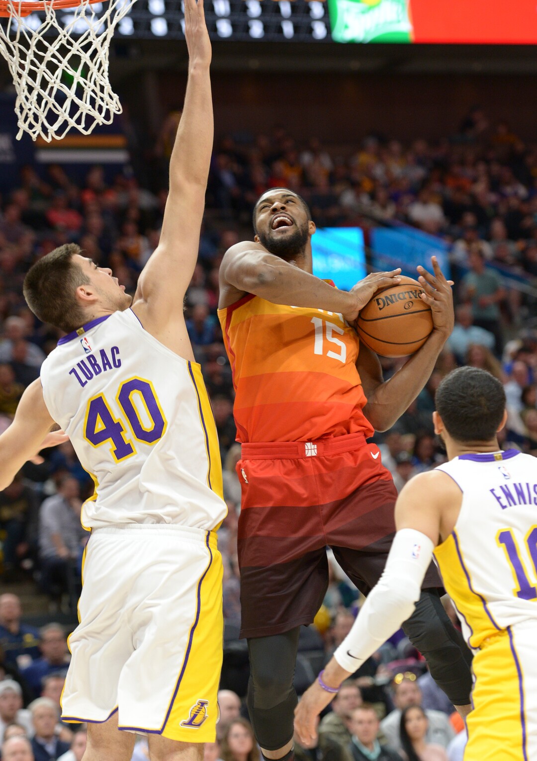 (Leah Hogsten  |  The Salt Lake Tribune)  Utah Jazz forward Derrick Favors (15) battles Los Angeles Lakers center Ivica Zubac (40) and Los Angeles Lakers guard Tyler Ennis (10) as the Utah Jazz host the Los Angeles Lakers at Vivint Smart Home Arena Tuesday, April 3, 2018