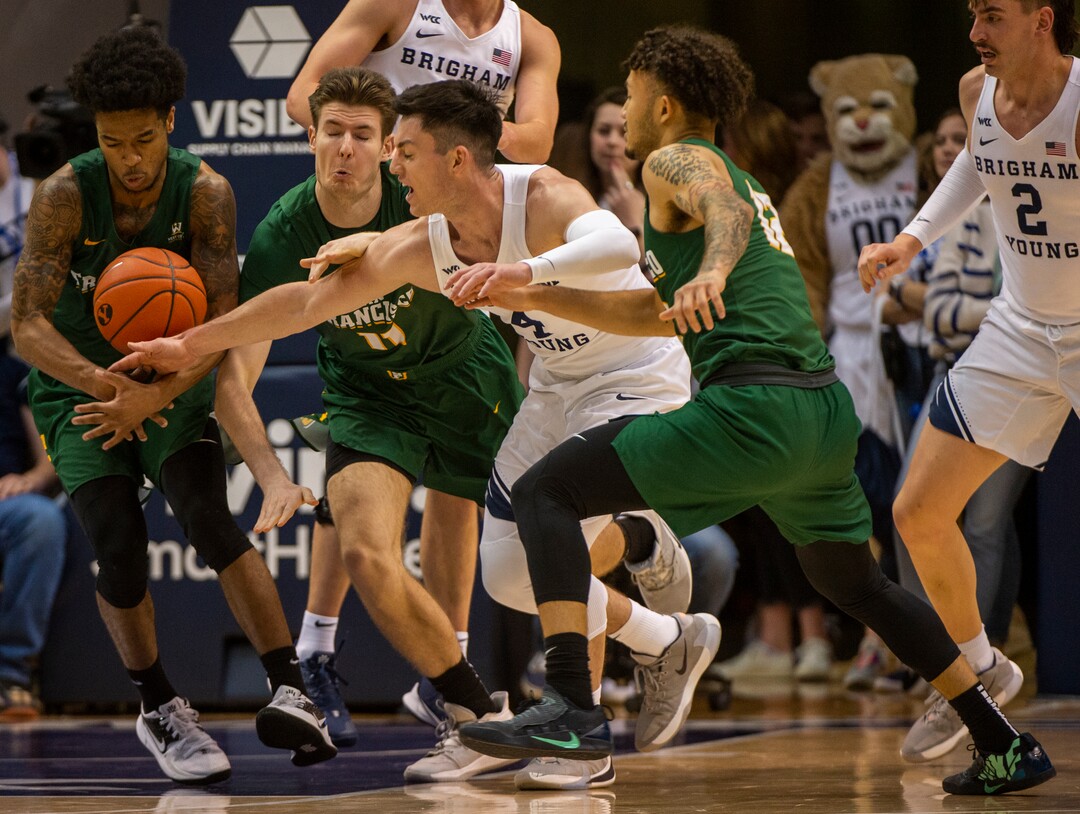 (Rick Egan  |  The Salt Lake Tribune)    Brigham Young Cougars guard Alex Barcello (4) goes for a loose ball along with San Francisco Dons guard Khalil Shabazz (0), in WCC basketball acton between the Brigham Young Cougars and the San Francisco Dons, at the Marriott Center, Saturday, Feb. 8, 2020.