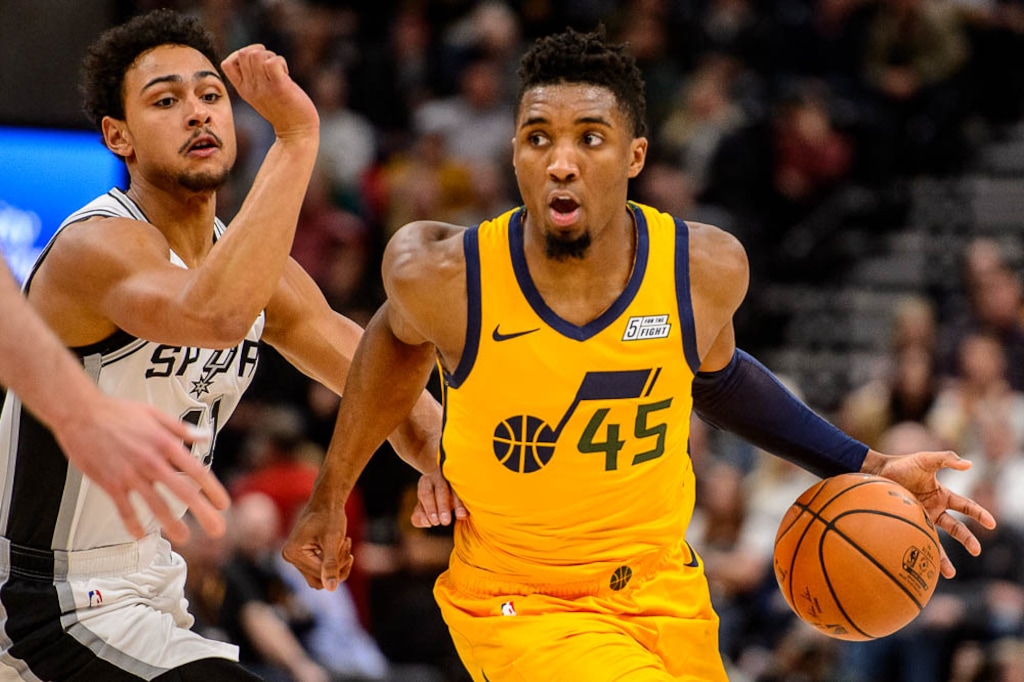 (Trent Nelson | The Salt Lake Tribune)  Utah Jazz guard Donovan Mitchell (45) defended by San Antonio Spurs guard Bryn Forbes (11). Utah Jazz v San Antonio Spurs, NBA basketball in Salt Lake City on Tuesday Dec. 4, 2018.