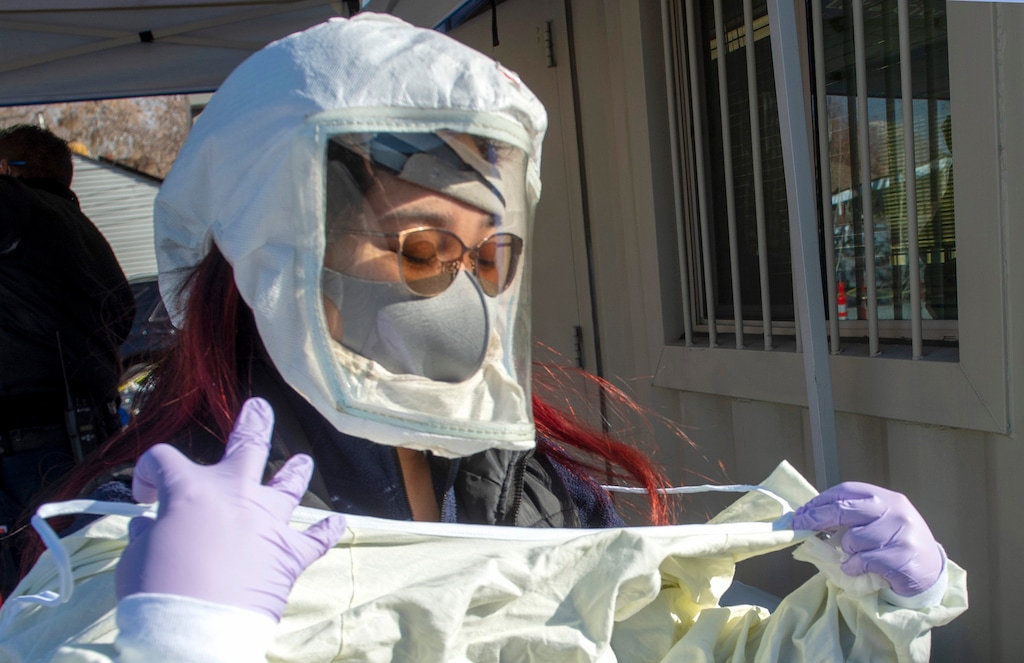 (Rick Egan | The Salt Lake Tribune) Zeanne Timbol prepares to conduct her next COVID-19 test, at the Intermountain Salt Lake Clinic, on Saturday, Jan. 2, 2021. More than 2 million Utahns have now been tested.