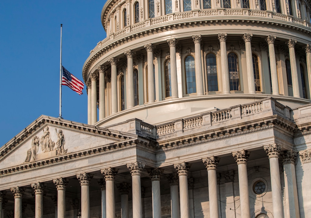 (J. Scott Applewhite | The Associated Press) The American flag flies at half-staff at the Capitol in honor of Sen. John McCain of Arizona who died Saturday of brain cancer, in Washington, Monday, Aug. 27, 2018. McCain will lie in state in the Capitol Rotunda on Friday.