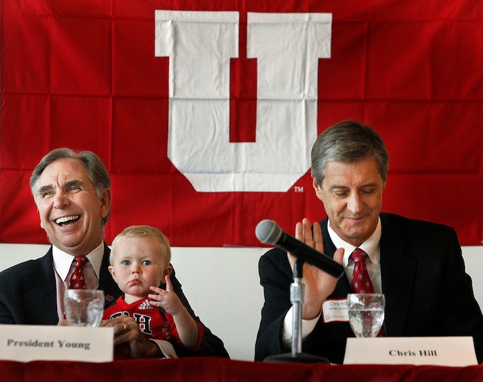 (Scott Sommerdorf  |  Tribune File Photo)  University of Utah President Michael Young (left) holds his grandson Bryce Owen (1 and a half years), in his lap as he spoke about the University's acceptance of the Pac-10's invitation to join the conference on Tuesday June 17, 2010. At right is Athletic Director Dr. Chris Hill.