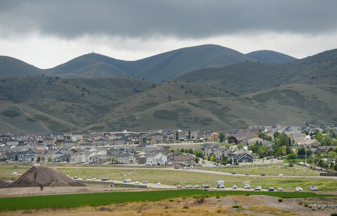 (Francisco Kjolseth  |  The Salt Lake Tribune)  Development continues to creep up against the Oquirrh foothills along the southwest bench in Salt Lake County near Herriman on Friday, May 17, 2019. A flurry of land use planning is underway covering SLCounty's west side, as growth pressure only gets more intense and we head toward a future of wall-to-wall city.