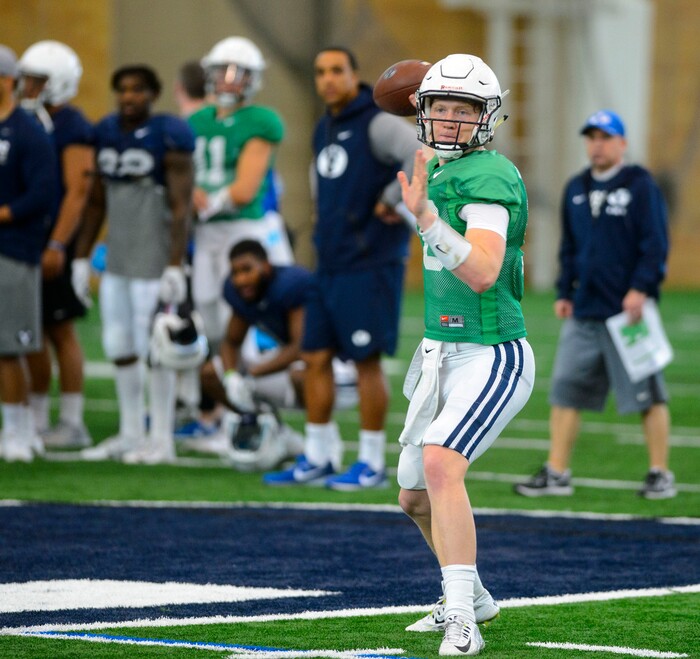 (Steve Griffin  |  The Salt Lake Tribune) BYU quarterback Joe Critchlow throws a pass during spring football practice for BYU in the indoor practice facility in Provo Thursday March 15, 2018.
