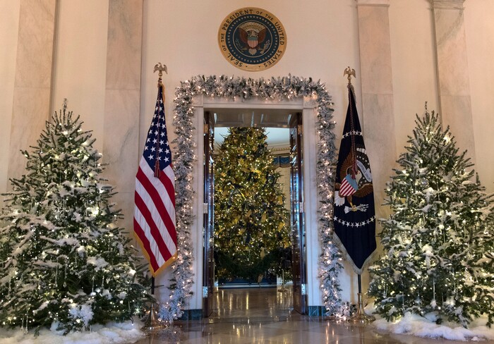 The official White House Christmas tree, center, is seen in the Blue Room during a media preview of the 2017 holiday decorations at the White House in Washington, Monday, Nov. 27, 2017. (AP Photo/Carolyn Kaster)