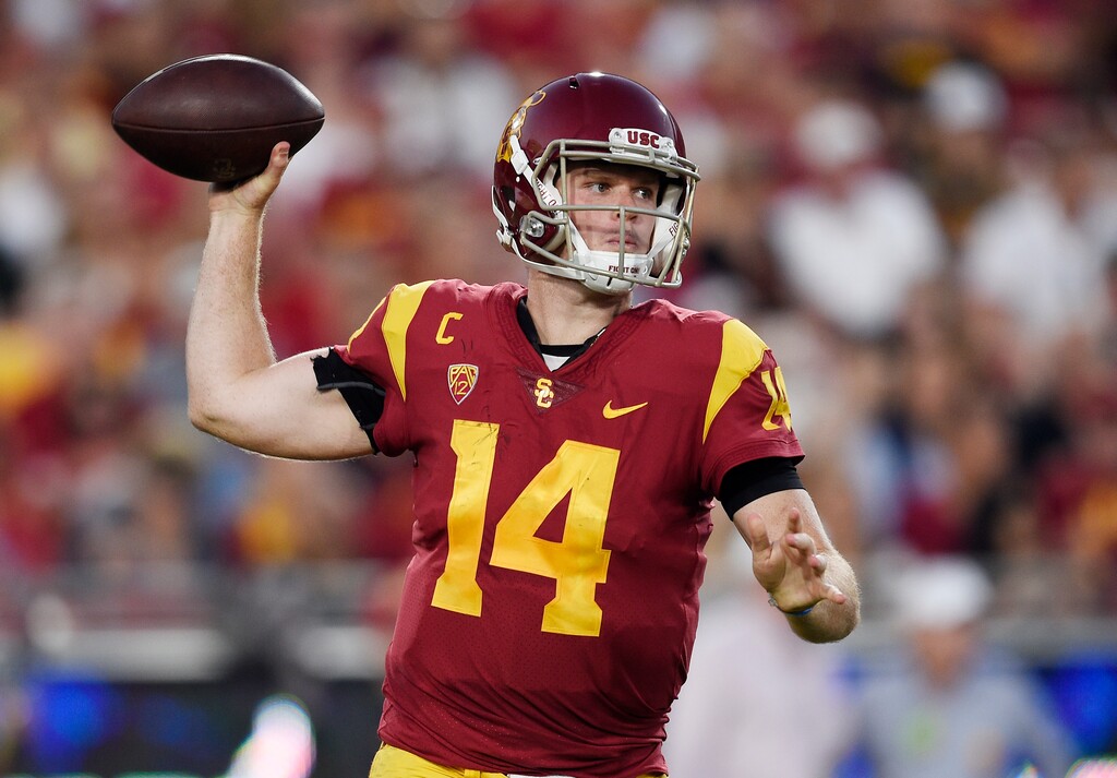 FILE - In this oct. 14, 2017, file photo, Southern California quarterback Sam Darnold passes the ball during the first half of an NCAA college football game against Utah, in Los Angeles. Quarterbacks Sam Darnold, Lamar Jackson and Josh Rosen are among the record 106 underclassmen given special entry to the NFL draft, making it four of the last five seasons in which at least 95 players have declared early. The NFL released Friday, Jan. 19, 2018, the official list of college players who have requested early entry.  (AP Photo/Kelvin Kuo, File)