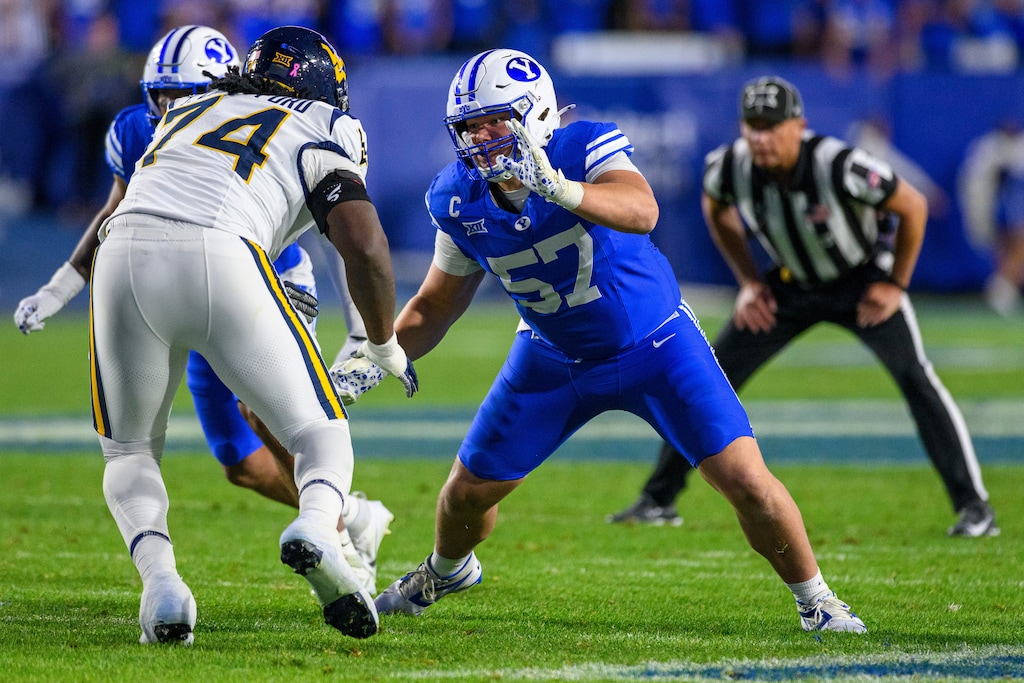 (Tyler Tate | AP) BYU defensive tackle Keanu Tanuvasa (57) plays against West Virginia on Oct. 3, 2025, in Provo, Utah.