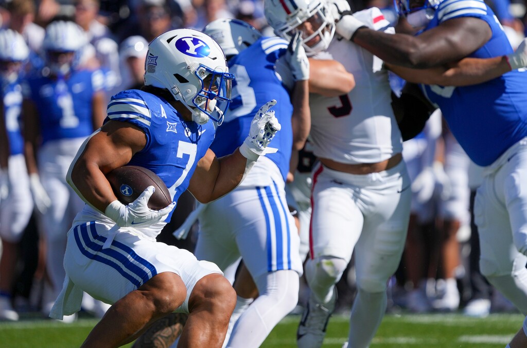 (Bethany Baker | The Salt Lake Tribune) Brigham Young Cougars running back Hinckley Ropati (7) runs the ball during the game between the Brigham Young Cougars and the Arizona Wildcats in Provo on Saturday, Oct. 12, 2024.