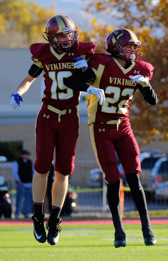 (Leah Hogsten  |  The Salt Lake Tribune) Viewmont's Britton Anderson and Noah Montoya celebrate an interception. Jordan High School boys' football team defeated Viewmont High School 28-20 during their class 5A football playoff opener, Friday, October 27, 2017 in Bountiful.