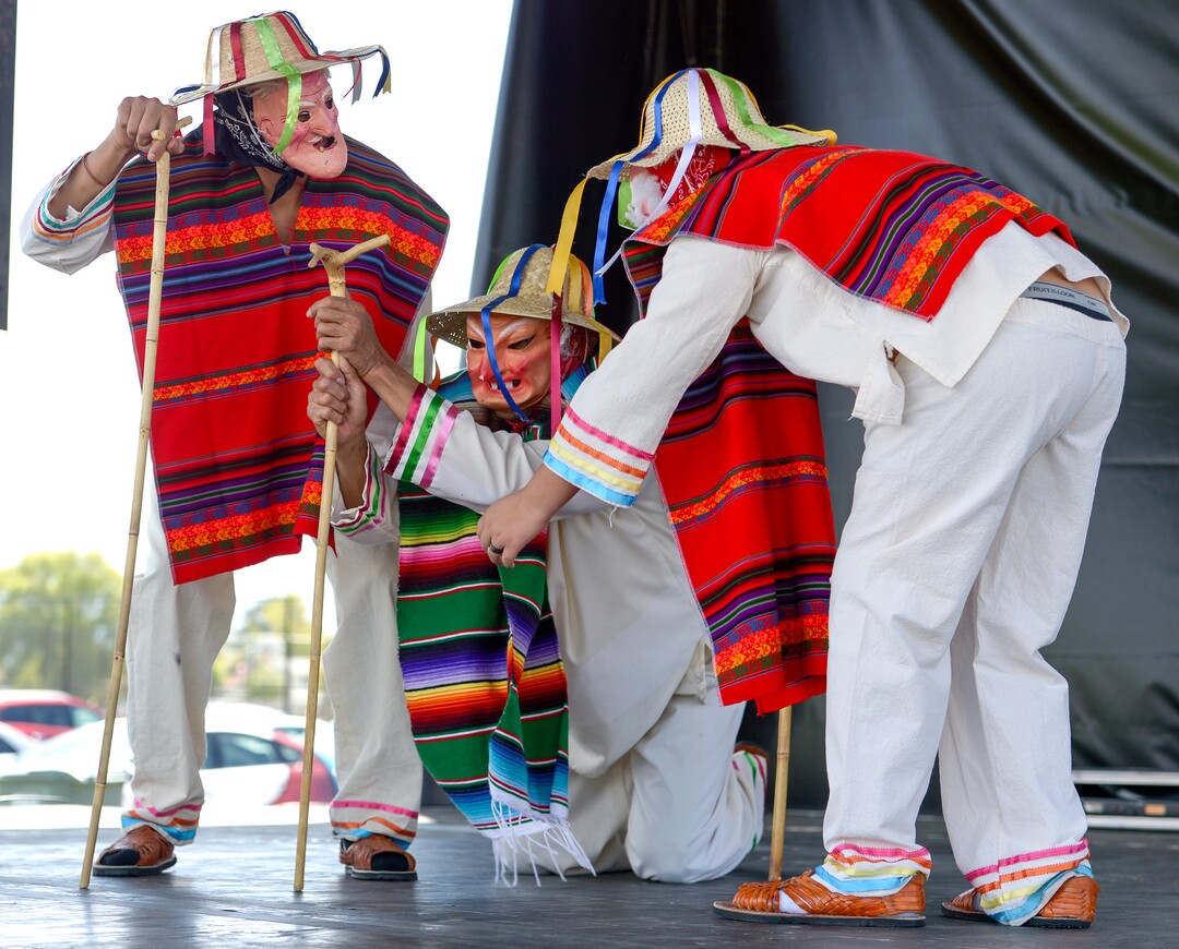 (Leah Hogsten  |  The Salt Lake Tribune) Tuttilli Ballet Folklorico dancers perform a traditional Michoacan, Mexico dance as an elder in the "Dance of Viejitos" at the Cinco de Mayo Celebration, Saturday, May 5, 2018 at Centennial Park in West Valley City.