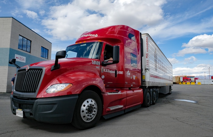 (Francisco Kjolseth | The Salt Lake Tribune) Truck drivers come and go at C.R. England trucking in Salt Lake City on Monday, March 30, 2020. The coronavirus outbreak has helped make truckers heroes as they help to stock empty shelves in stores. Drivers face new challenges from finding restrooms and food on the road amid shutdowns, but say they enjoy driving with no congestion.