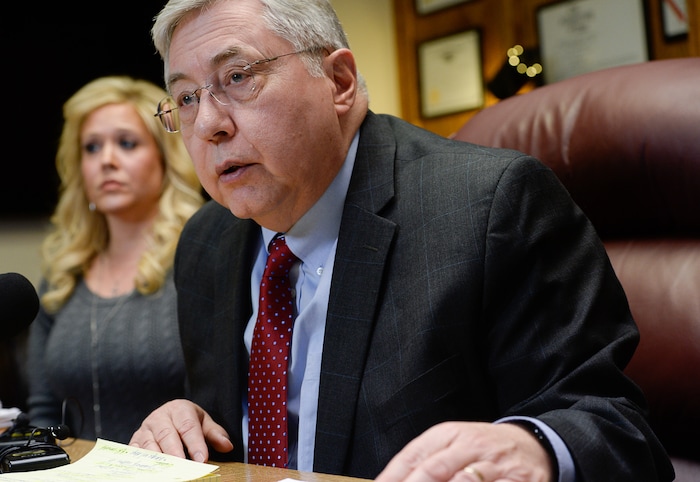 (Francisco Kjolseth | The Salt Lake Tribune) Heather Leyva, listens as her attorney Robert Sykes, discusses the sexual harassment lawsuit he is filing on her behalf against Utah trooper Sgt. Blaine Robbins, during a press conference at his law offices in Salt Lake City Wed. Feb. 7, 2018. According to the lawsuit, the trooper hounded her with unwanted sexually charged messages and used his position and authority to stalk her.