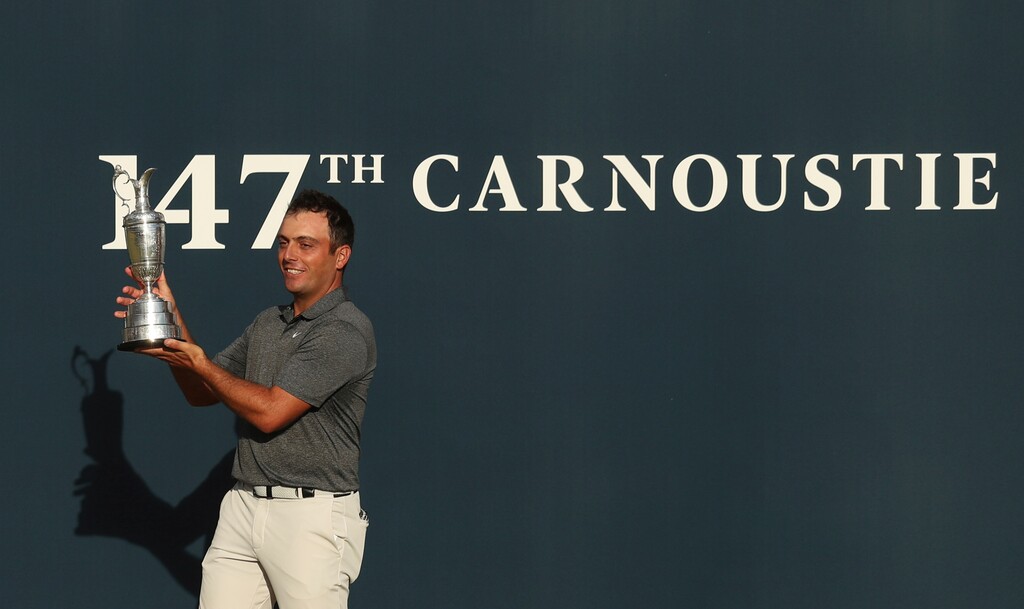 Francesco Molinari of Italy holds the trophy after winning the British Open Golf Championship in Carnoustie, Scotland, Sunday July 22, 2018. (AP Photo/Jon Super)