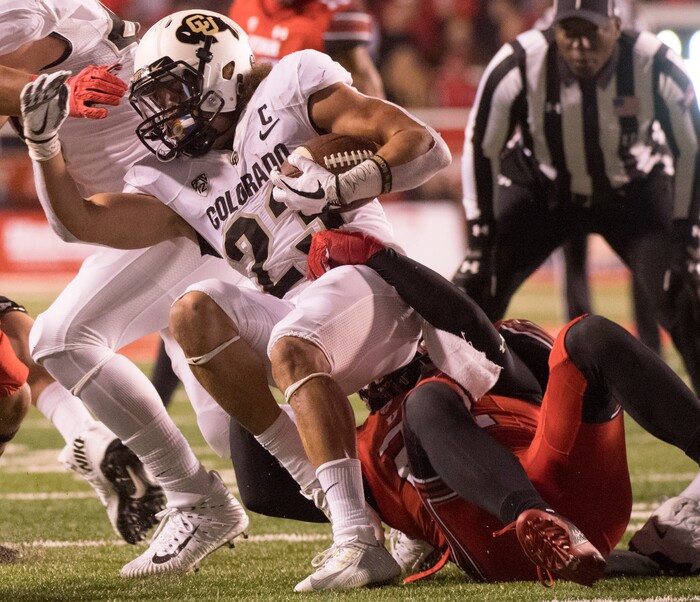 Utah Utes defensive back Chase Hansen (22) Colorado Buffaloes running back Phillip Lindsay (23) for a loss, in PAC-12 football action Utah Utes vs. Colorado Buffaloes at Rice-Eccles stadium, Saturday, November 25, 2017.
