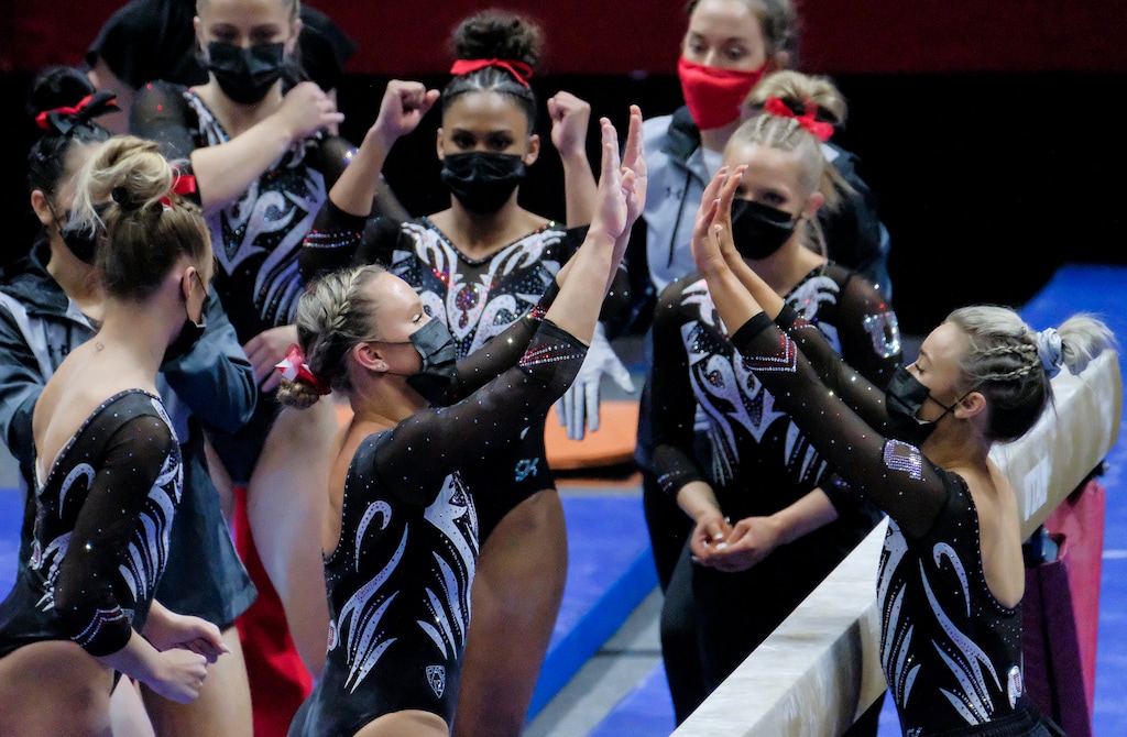 (Leah Hogsten | The Salt Lake Tribune) Maile O'Keefe celebrates her performace on beam with the team. University of Utah Red Rocks defeated Utah State University women's gymnastics team 197.275 to 196.450, Mar. 12, 2021 at the Jon M. Huntsman Center.