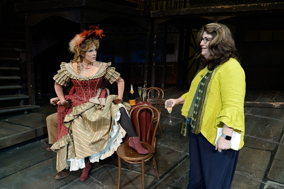 (Francisco Kjolseth  |  The Salt Lake Tribune)  Director Kathleen Clawson, right, sets up scenes for set photos as Utah Opera's season opener, "La bohème," Puccini's popular tearjerker about starving artists in turn-of-the-century Paris, opens for five shows on Oct. 7, 2017. On set was Celena Shafer (Musetta), showing a little leg for fun.