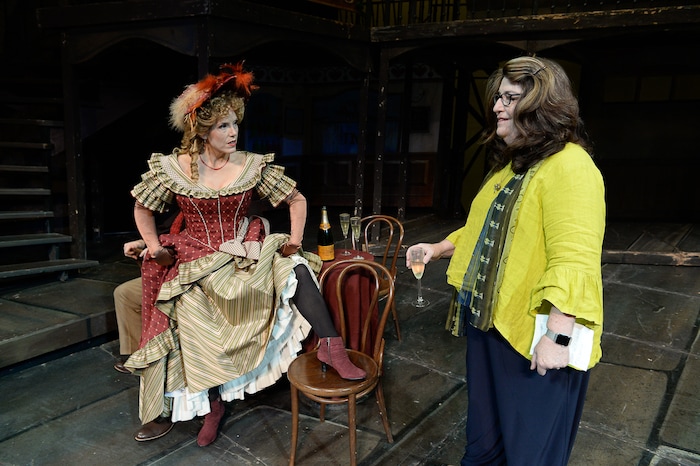 (Francisco Kjolseth  |  The Salt Lake Tribune)  Director Kathleen Clawson, right, sets up scenes for set photos as Utah Opera's season opener, "La bohème," Puccini's popular tearjerker about starving artists in turn-of-the-century Paris, opens for five shows on Oct. 7, 2017. On set was Celena Shafer (Musetta), showing a little leg for fun.